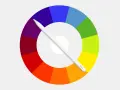 Rueda de colores con tonos ordenados por tonos, cruzada por un lápiz digital blanco.
