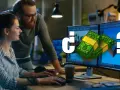 ¿Cuánto cobra un diseñador de videojuegos? Dos personas trabajan en monitores con gráficos de dinero y un signo de interrogación.