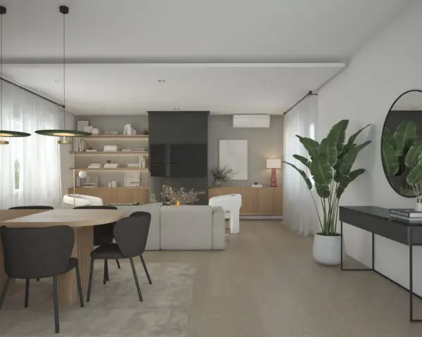 Un elegante salón moderno con mesa de comedor, sofás, estanterías y una consola. El diseño de espacios interiores crea un ambiente acogedor y sofisticado.
