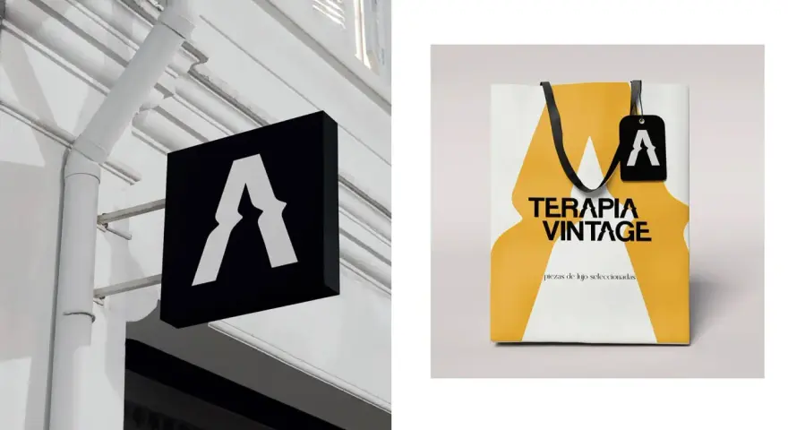 Letrero negro con logo "A" y bolsa de compras "TERAPIA VINTAGE". Salidas de diseño gráfico.